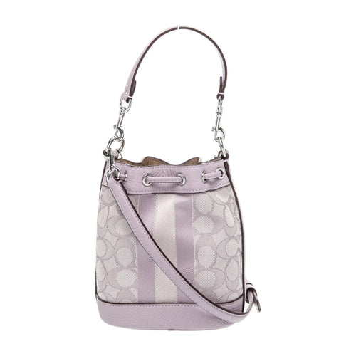 Coach Dempsey Small Bucket Bag in lavender signature jacquard fabric, featuring a compact design with a top handle and drawstring closure.
