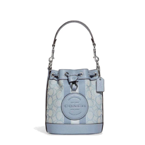 Coach Dempsey small bucket bag in marble blue signature jacquard fabric, featuring a rounded shape and leather accents.