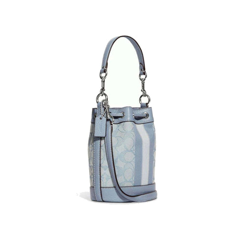 Coach Dempsey small bucket bag in marble blue signature Jacquard with leather trim and drawstring closure.
