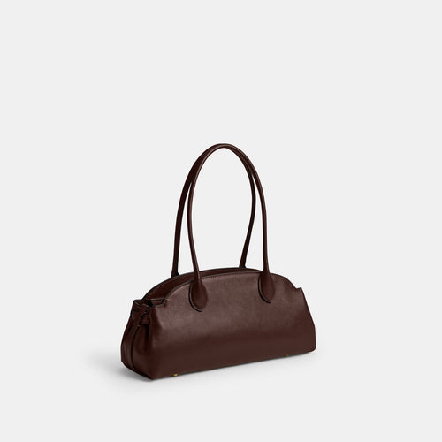 Coach Empire Carryall Bag 34 in brass maple leather, featuring a spacious design and elegant craftsmanship.