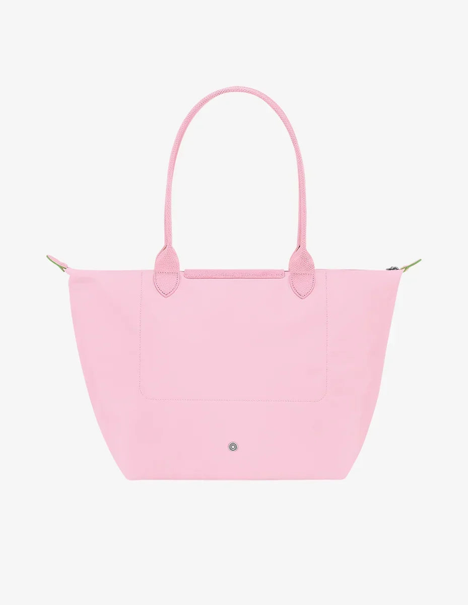 Longchamp Le Pliage green L tote bag with pink accents, showcasing its lightweight, foldable design and durable fabric.