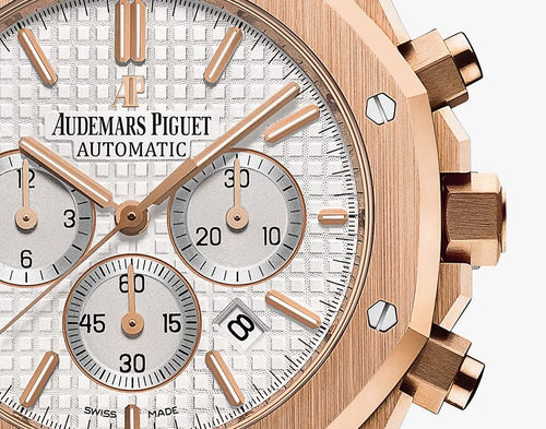 Audemars Piguet Royal Oak men's watch with gold case, black dial, and stainless steel bracelet, showcasing luxury watch design.