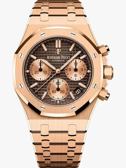 Audemars Piguet Royal Oak men's watch with gold case, silver dial, and stainless steel bracelet shown in close-up image.