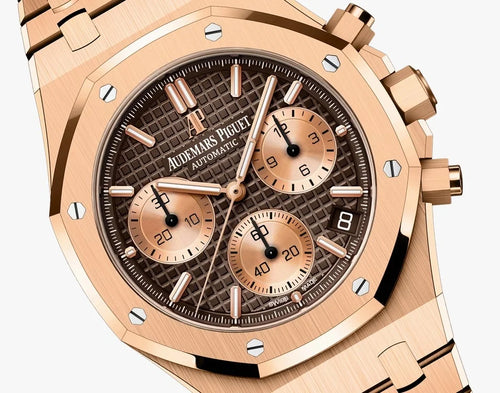 Audemars Piguet Royal Oak men's watch with rose gold case, black dial, and stainless steel bracelet, showcasing luxury watch design.