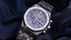 Audemars Piguet Royal Oak men's watch with stainless steel case, silver dial, and integrated bracelet displaying time.