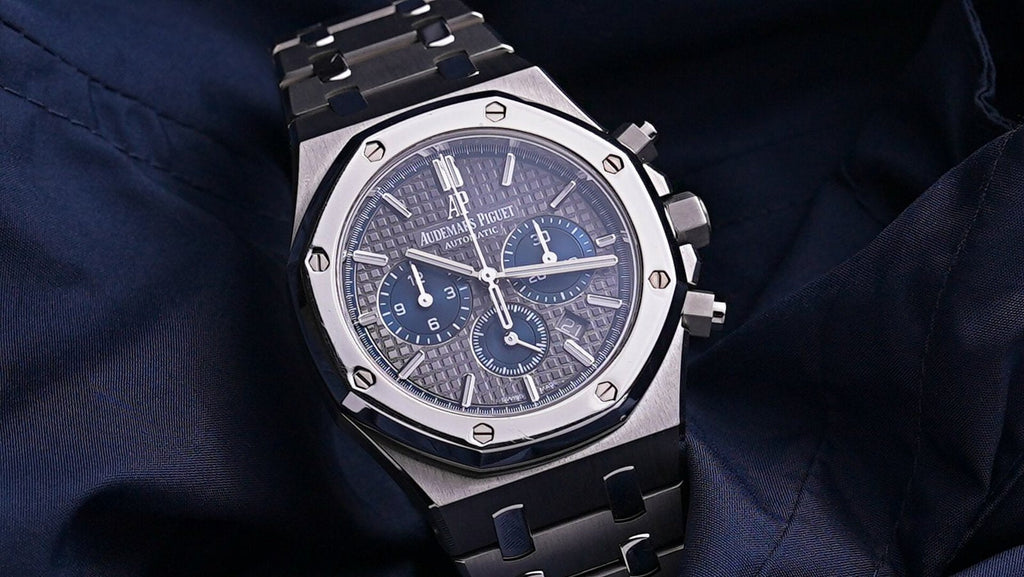 Audemars Piguet Royal Oak men's watch with stainless steel case and blue dial, featuring a sleek, elegant design.
