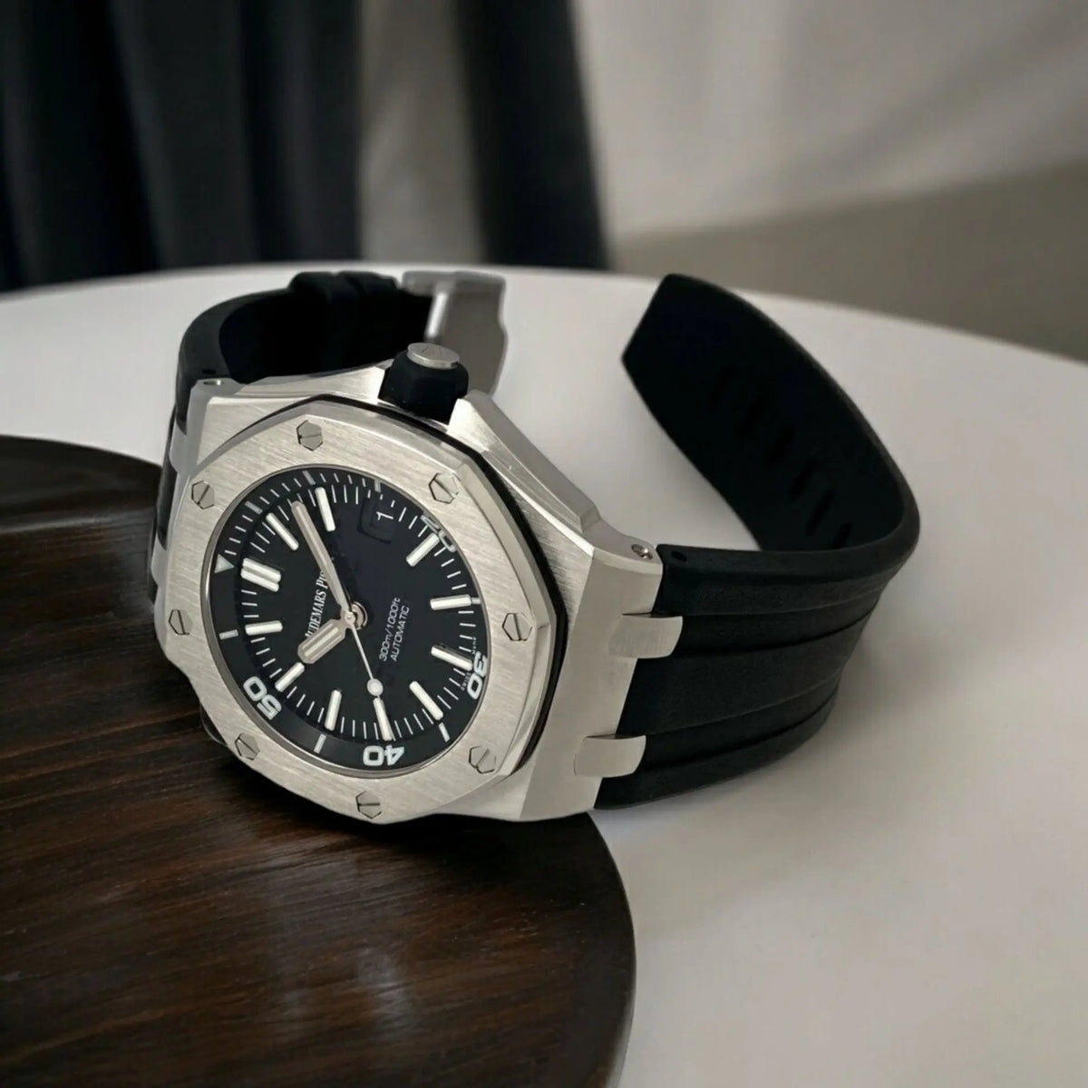 Audemars Piguet Royal Oak Offshore men's watch with stainless steel case, black dial, and sporty design.
