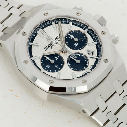 Audemars Piguet Royal Oak men's watch with stainless steel case and bracelet, silver dial, and signature octagonal bezel.