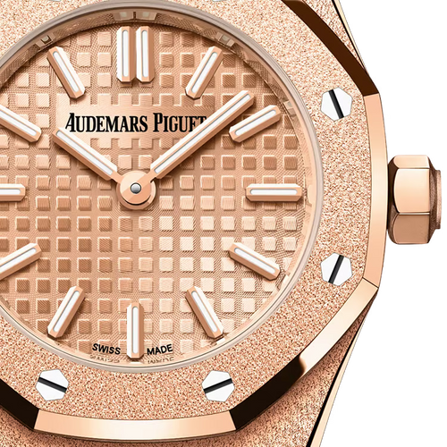 Audemars Piguet Royal Oak women's watch with gold case, elegant design, and brown leather strap.