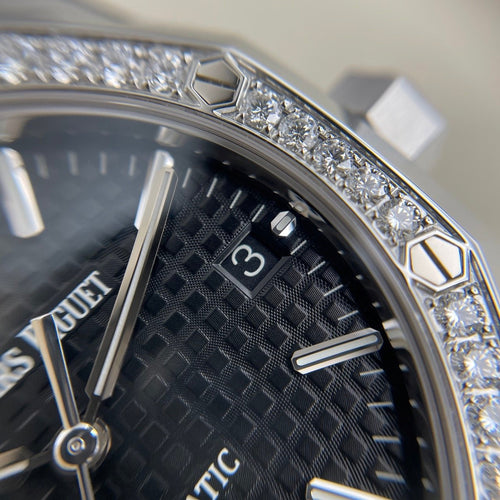 Audemars Piguet Royal Oak women's watch with stainless steel case and bracelet, featuring a detailed dial and elegant design.