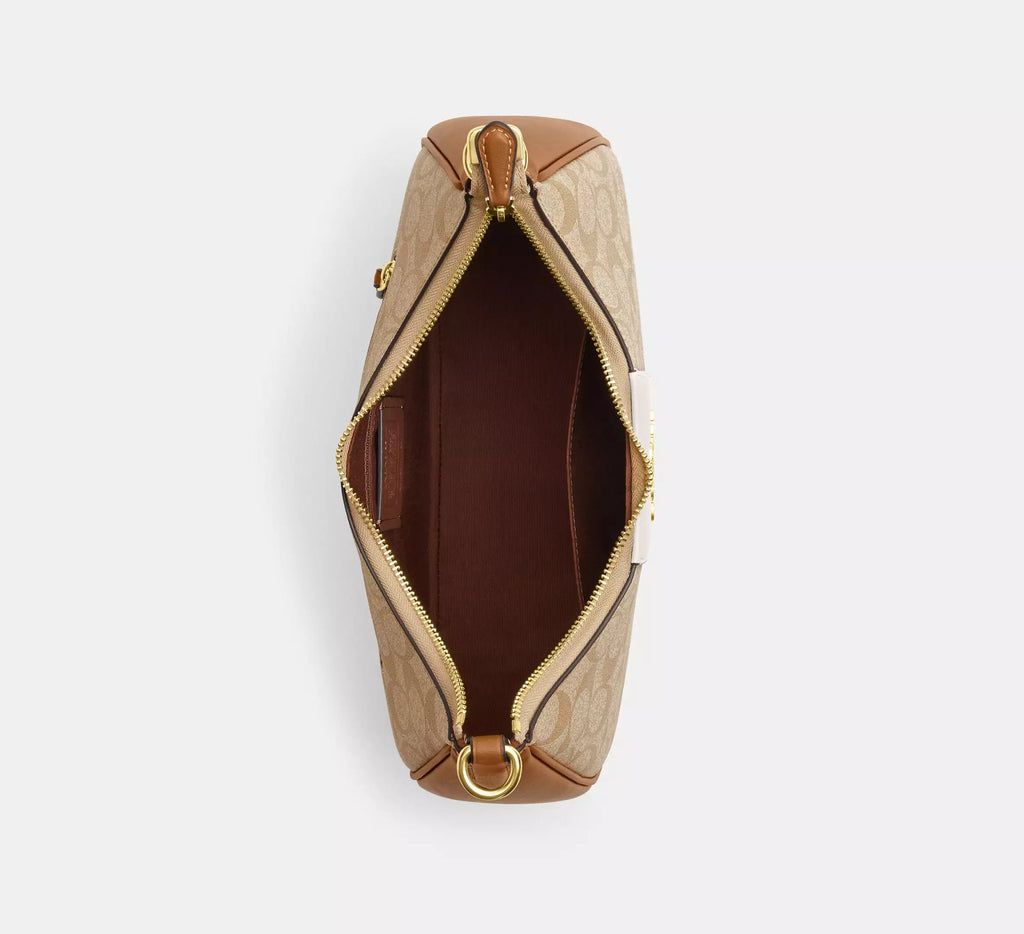 Coach Teri Hobo Bag in signature canvas with stripe, wine-colored leather accents and spacious design.