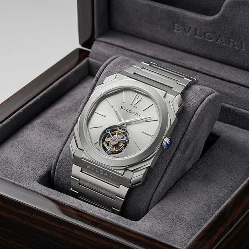 Bvlgari Men’s Octo watch with silver dial and open-heart design, showcasing intricate watch face and elegant craftsmanship.