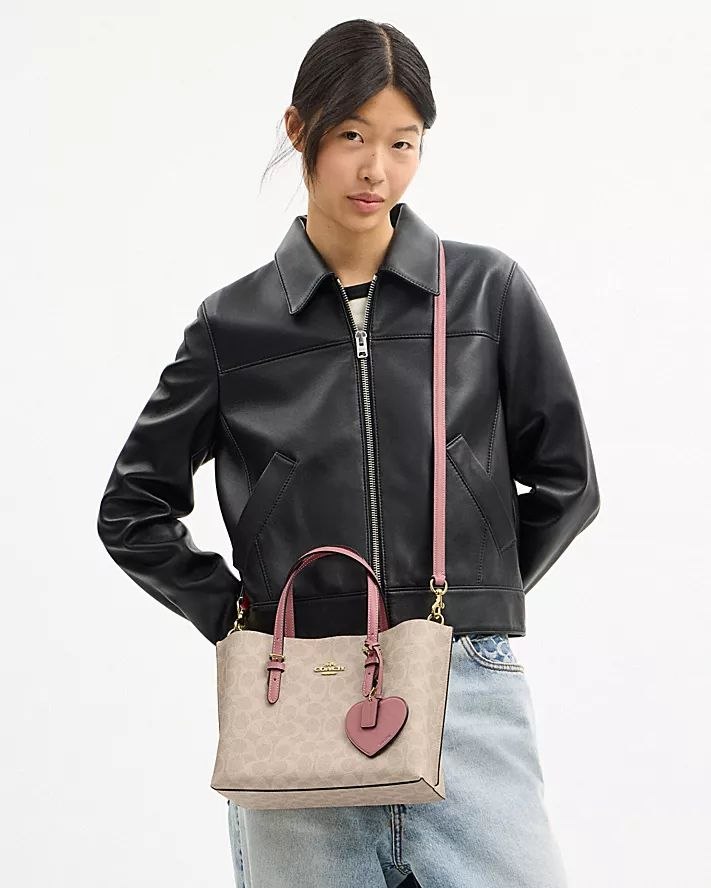 MOLLIE TOTE BAG 25 IN SIGNATURE CANVAS WITH HEART CHARM