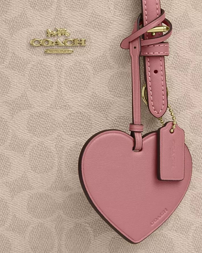 MOLLIE TOTE BAG 25 IN SIGNATURE CANVAS WITH HEART CHARM