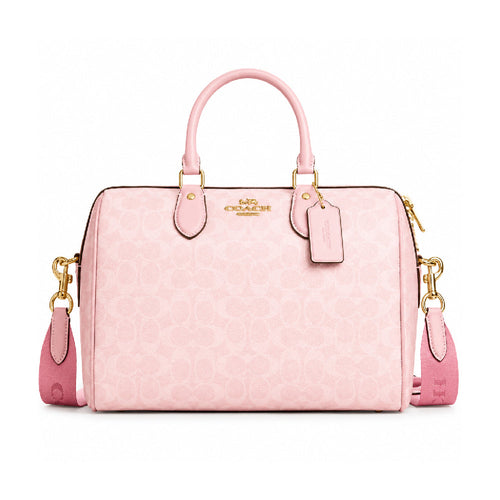 Coach Mini Rowan Crossbody Bag in baby pink with adjustable strap and gold-tone hardware, compact and stylish for everyday use.