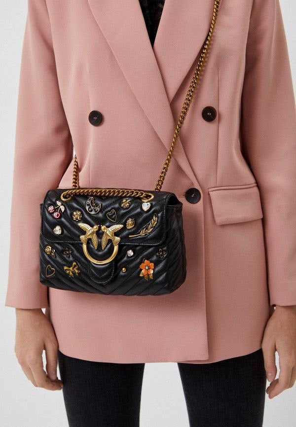 Pinko Love Mini Lady Puff Magic Pins attached to a stylish pink bag, showcasing unique decorative pins by Pinko.